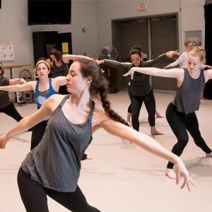 AACC students dance in a studio classroom.